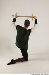 KEETA KNEELING POSE WITH SWORD